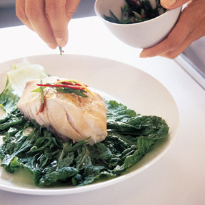 serving fish on a cabbage leaf