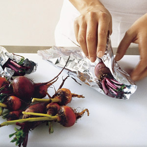 wrapping raw beetroots in aluminium foil