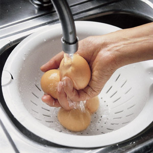 cooling down hard-boiled eggs under the tap
