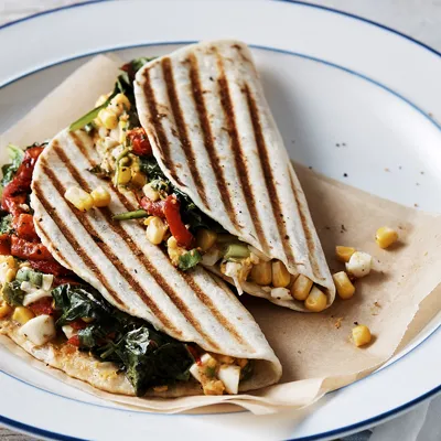 Grilled wraps with beans, spinach, capsicum and lettuce