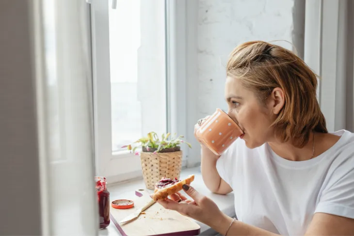 Woman drinking coffee, Weight Management During Menopause