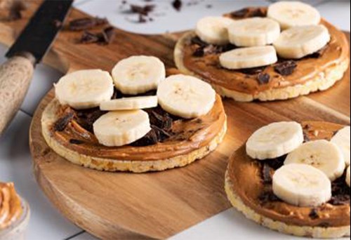 Corn thins with peanut butter and banana topping.