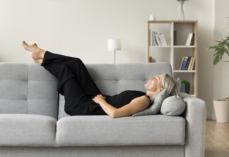 Woman laying on the couch.